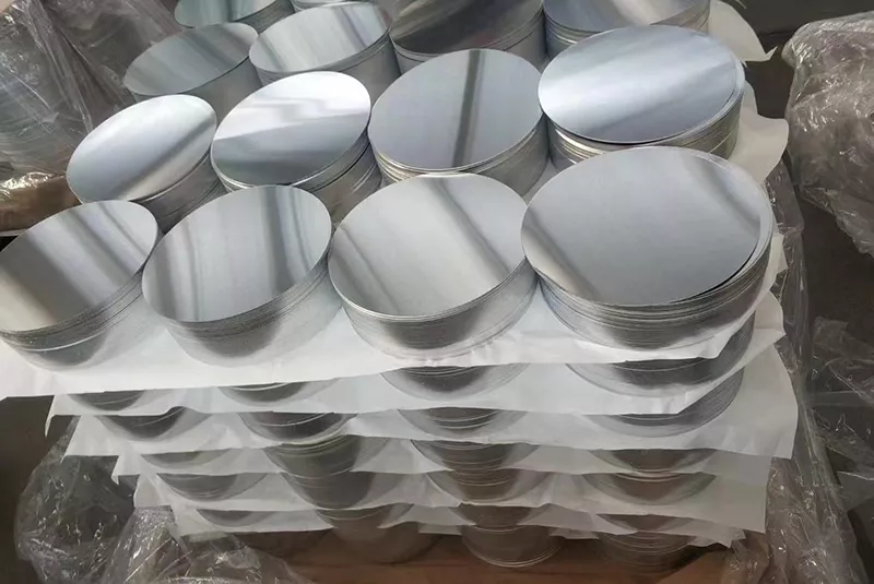 Stacked 4 inch aluminum discs with smooth burr-free edges