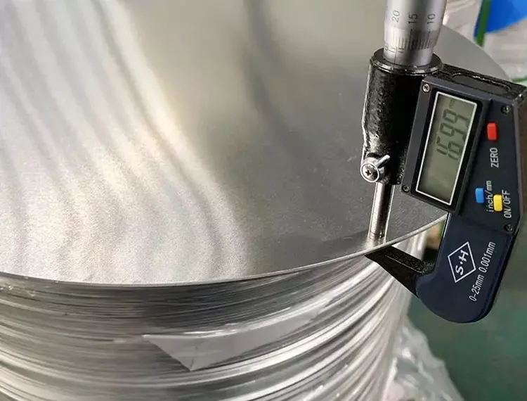 Aluminum circle plate thickness inspection during quality control at Haomei Aluminum factory